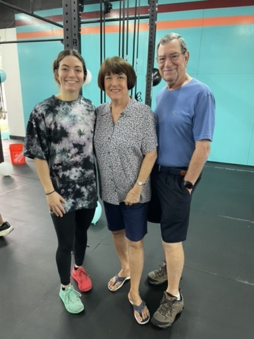 Coach Mckenzie Cushard with her grandparents at CrossFit Renegade